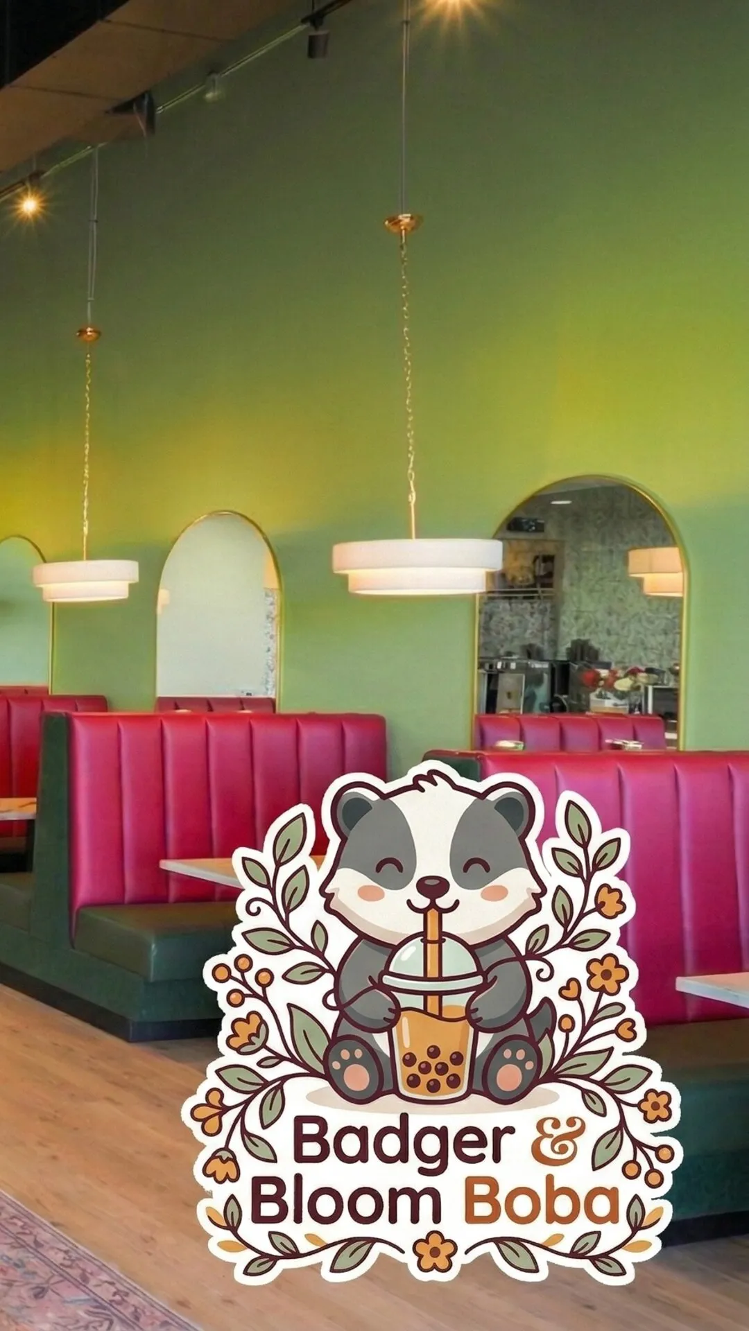 Interior of Badger & Bloom Boba with green walls, pendant lights, and pink booth seating. Badger & Bloom Boba logo in the foreground.